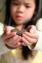 child giving money